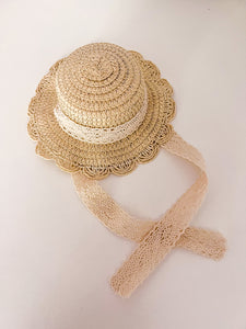STRAW HAT WITH A RIBBON TIE