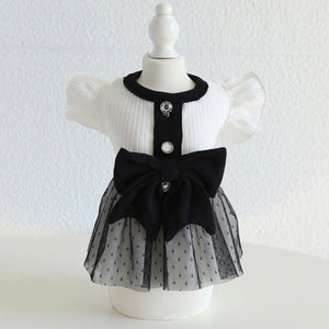 BLACK AND WHITE DRESS WITH BLACK BOW